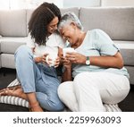 Small photo of Relax, laughing and senior mother and daughter with coffee cup for home conversation, talking and bonding together. Black family, people or woman with elderly mom love, tea and living room carpet