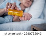 Small photo of Insomnia pills, depression and senior woman in bed sleeping for pharmaceutical, psychology or mental health. Depressed, addiction and medicine of sick elderly person, drugs help or risk in bedroom