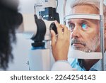 Small photo of Ophthalmology, medical and eye exam with old man and consulting for vision, healthcare and glaucoma check. Laser, light and innovation with face of patient and machine for scanning and optometry