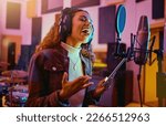 Small photo of Tablet, music and woman singing in a studio for radio, song production and rehearsal. Creative, voice and a singer making a record, track or recording a musical sound as a professional artist
