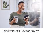 I needed a good distraction from my hectic schedule. Shot of a businesswoman drinking coffee and using her cellphone while standing in an office.