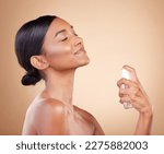 Perfume, woman or luxury fragrance product of a model feeling confident about parfume smell or skincare. Spa, marketing or dermatology aesthetic of spray bottle for neck or girl self care in studio
