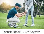 Small photo of Golf lesson, teaching and sports coach help man with swing, putt and stroke outdoor. Lens flare, green course and club support of a athlete ready for exercise, fitness and training for a game