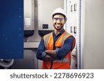 Small photo of Portrait, happy man and engineering technician in control room, inspection service or industry maintenance. Electrician, arms crossed and smile in electrical substation, system or industrial mechanic