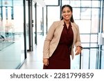 Small photo of Self confidence is a key entrepreneurial trait for success. Portrait of a young businesswoman standing in an office.