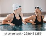 Small photo of Swimming pool, sports and women laughing in water, joke and funny comedy after exercise. Swimmer, happiness and friends or girls talking, laughter and comic discussion with humor after training.