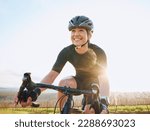 Cycling, fitness and happy with woman in park for training, workout and cardio health. Exercise, travel and freedom with female cyclist riding on bike in nature for adventure, journey and transport