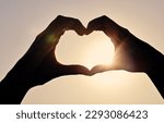 Small photo of Youre my better half. Closeup shot of two women forming a heart shape with their hands.
