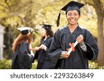 Small photo of Im excited to celebrate this day with my peers. Portrait of a young woman holding her diploma on graduation day.