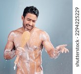 Small photo of Handsome young man singing in the shower. Happy male holding shower brush while rinsing soap off his body under clean running water. Handsome hunk doing his morning self-hygiene and body