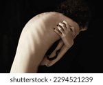 Small photo of Anorexia, bulimia and back of woman in studio for weight, obsession and ashamed on black background. Eating disorder, mental illness and spine of girl suffering phobia, body dysmorphia or disgust
