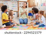 Small photo of If you happy and you know it, clap your hands. Shot of a teacher singing with her preschool children.