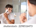 Mirror  shaving and face of man ...