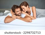 I want to love you forever and a day. a happy young couple relaxing in bed together at home.