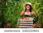 Farmer, agriculture and portrait of woman with box on farm after harvest of summer vegetables. Farming, female person and smile with crate of green product, food and agro in nature for sustainability
