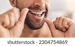 Small photo of Closeup, face and man flossing teeth at home for healthy dental wellness, plaque and gingivitis. Happy guy, oral thread or cleaning mouth for fresh breath, tooth hygiene and habit to care for smile