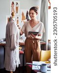 Small photo of Fashion, happy woman and designer with mannequin, tablet and smile at creative small business for clothing. Happiness, creativity and tailor, designer with clothes on doll, online design at start up.
