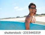 Beach, summer and surfboard with man friends outdoor together for travel, vacation or holiday trip overseas. Surfing, sea or fun with a young male surfer in sunglasses and friend bonding on the coast