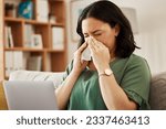 Small photo of Remote work, laptop and sick woman on a sofa with flu, cold or viral infection in her house. Freelance, sneeze and lady online with allergies, virus or burnout, sinusitis or hayfever while working