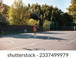 Its not about how good you are, its how good you want to be. Shot of a sporty young woman throwing a basketball into a net on a sports court.