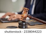 Small photo of Judge, hammer and man hands on laptop for legal research, typing report and compliance, justice or contract management. Attorney, advocate or lawyer person on computer and gavel for article or rules