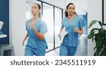 Small photo of Doctors, nurses or running in hospital emergency, patient crisis or pager call in ICU stress, trauma fail or diversity clinic. Healthcare women, rushing or run in medical hallway to code blue problem