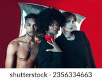 Small photo of Queer, diversity and portrait of people in fashion with creative black woman, gay man and model on red background in studio. Lgbt, friends and beauty for edgy, aesthetic or unique makeup and clothes