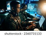 Military control room, computer and soldier at desk, typing code and tech for communication army office. Security, global surveillance and black man at laptop in government cyber data command center.