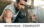 Small photo of Serious man, dumbbell and weightlifting in workout, exercise or fitness at indoor gym. Active male person, bodybuilder or athlete lifting weight for intense arm training, strength or muscle at club
