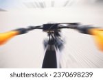 Small photo of Motorbike, race and motion blur of sports person and handle bars, speed in desert or dunes with athlete. Dirtbike, fast and adrenaline in extreme sports, fitness and energy for competition in pov