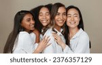 Small photo of Women, group skincare and beauty with love, hug and support in diversity and inclusion on brown studio background. Friends, model or people smile together and kiss in dermatology, skin care or makeup