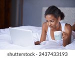 Black woman, computer or tea in bed to relax, scroll or search on internet, social media or network. Female influencer, coffee or laptop as checking, message or email for viral meme and blog post