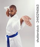 Small photo of Studio, karate and black man with technique for martial arts with hand strike, shuto uchi and training. White background, adult and African male person with healthy body for movement and disciple