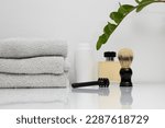Small photo of Shaving accessories for man on table. shaving equipment. tools, kit. Men's shaving accessories. shaver, Brush, shaving foam, Razor, blade. aftershave lotion. beauty care accessories. male self care.