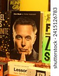 Small photo of London, England, UK - November 23, 2023: Cover of the Elon Musk biography by Walter Isaacson in the storefront of Daunt Books Marylebone