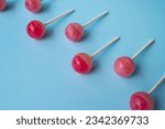 Colorful sweet lollipops. Color lollipop. bright cool candy. copy space. ball lollipops. Round candies on stick. Yummy Lollipops background.