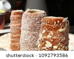 Close up retail display with ready to eat sweet Trdelnik, this spit cake is popular in Europe, Austria, Hungary, Slovakia and Czech, especially in Prague