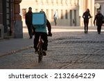 Courier On Bicycle Delivering...