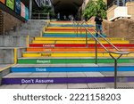 Small photo of Sydney, Australia - May 20, 2021: Positive slogan typescript on colorful staircase at The Quadrangle of The University of New South Wales (UNSW). Motivation to students. People walking about.