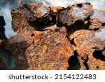 Small photo of Dirty rusted metal texture for background. Ecology and recycling. Rusty scrap metal in a landfill in natural light. Corrosive Rust on old iron. Oxidated metal. The passage of time