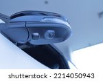 A camera system in the top view mirror helps drivers see the vehicle's blind spots to reduce road accidents. parking assist technology Transportation and Security copy space
