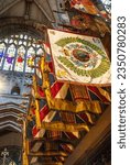 Small photo of Lichfield UK - Aug 17 2023: British military regimental flags hanging in the south transept of Lichfield Cathedral, Staffordshire, UK. The flags, which list battle honours, are from British Army