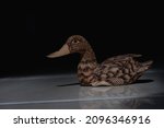 A Duck Statue Made Of Wood As A ...