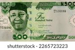 Small photo of Dr. Nnamdi Azikiwe (1904-1996) - First President of the Federal Republic of Nigeria. Ornamental security patterns adapted from Nigerian traditional art. Portrait from Nigeria 500 Naira 2022 Banknotes.