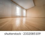 Empty wooden floor closeup and room ceiling and doors with light reflection