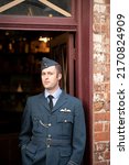 Small photo of Dudley, West Midlands-united kingdom July 13 2019 a young male airman in royal air force uniform stands in a doorway