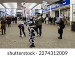 Small photo of Salford, Manchester, uk, march 11, 2023 Person with cow mask protest against dairy farming, condemned by the protestors because of infringement of animal rights.