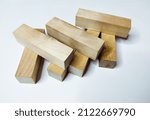 Small photo of Wooden rectangular figures for playing django on a white background.