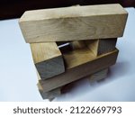 Small photo of Wooden rectangular figures for playing django on a white background.