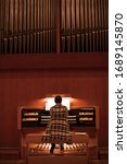 Organist Playing A Pipe Organ